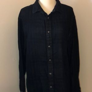 Men’s slightly distressed button up shirt.